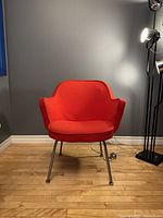 Front view of red Knoll Saarinen Model 68 chair