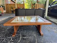 Full front view of teak coffee table