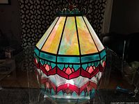 Full view of stained glass light fixture showing colours and shape