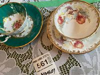 Both Aynsley teacup and saucer sets, showing patterns and overall condition