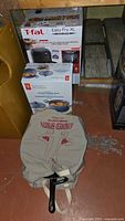 T-fal air fryer box, Starfrit pot box, cast-iron wok in cloth bag