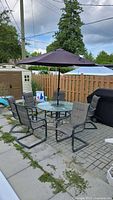 entire patio set with table, six chairs, umbrella