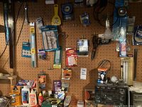 Overall view of pegboard with bulbs, organizer, adhesives
