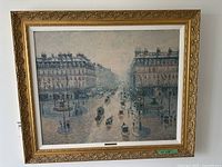 Full view of framed Paris street scene art print on wall