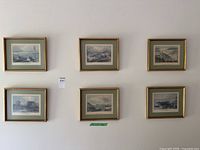 Wide shot of all six matching framed prints on wall