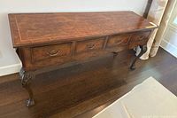 Front view showing four drawers, apron, legs and finish