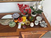 Overview of entire lot on wooden sideboard