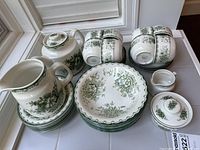 Full set showing plates, bowl, pitcher, teapot, cups, saucers, creamer, covered dish