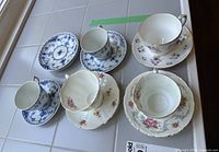 Group shot of all five teacup and saucer sets