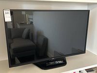 Front view of LG television on stand