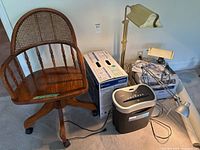 Group shot of chair, printer box, shredder, printer, lamps