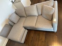 Top view of grey sectional showing cushions and chaise