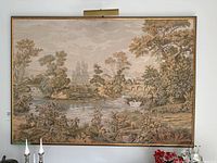 Full view of framed tapestry on wall showing size and frame