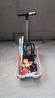 Lot overview showing floor pump, bin with locks and accessories