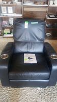 Front view of black Bell'O HTS100 recliner with cup holders and manual included