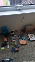 Group view of all devices, cables, and boxes on carpet