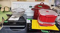 Induction cooktops, stock pot, steamers, strainer on range