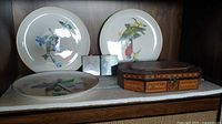 Three plates, two plaques, inlaid wood box displayed on shelf