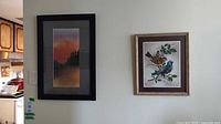 Both framed artworks on wall for size and style reference