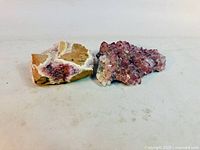 Both amethyst clusters side by side showing size relation