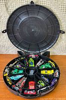 Wheel case open showing all compartments filled with cars