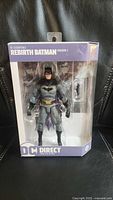 Front view of sealed DC Essentials Rebirth Batman Version 2 box showing figure and accessories