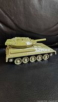Side profile of olive green Alvis Scorpion die-cast tank