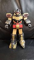 Front view of Black & Gold Megazord figure