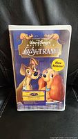 Front of sealed Lady and the Tramp clamshell with promo sticker