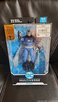 Front view of sealed Owlman figure in retail box
