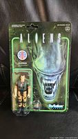 Front of sealed Super7 ReAction Aliens Hudson figure card