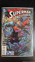 Front cover of Superman Unchained #1 in bag