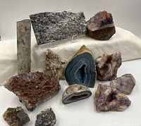 All twelve mineral specimens grouped together