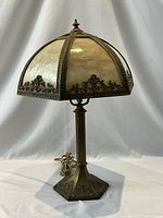 Full view of lamp showing slag glass shade and bronze base