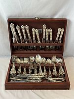 Open chest showing full assortment of flatware pieces in racks