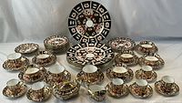 Entire 53-piece Imari bone china dinnerware set displayed