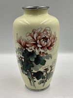 Full front view of cloisonné vase, chrysanthemum design visible