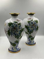 Front view of both cloisonné vases showing large chrysanthemum design
