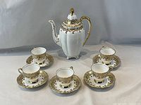 Full set coffee pot with 5 cups and saucers