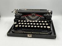 Front view of Underwood Standard Portable typewriter on base