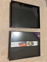 Both shadow box frames, one sealed one opened