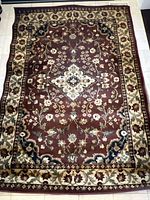 Full view of one area rug showing overall pattern and colors