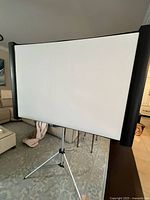 Front view of unfolded projection screen on stand