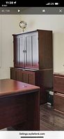 Armoire in office setting showing overall form and finish