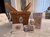 Woven basket, standing child figurine, desk plaque, ceramic bowl, illustrated box