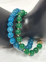 Both bracelets displayed on mannequin hand