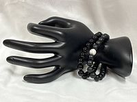 Both bracelets on display hand, showing overall look