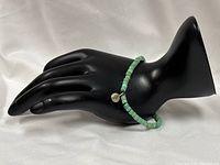 Full view of anklet displayed on mannequin hand