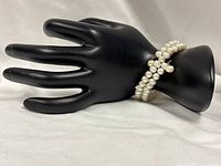 Bracelet displayed on mannequin hand to show size and wrap style