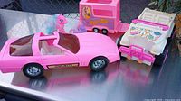 Overview of Corvette, two horse trailers and My Little Pony figures